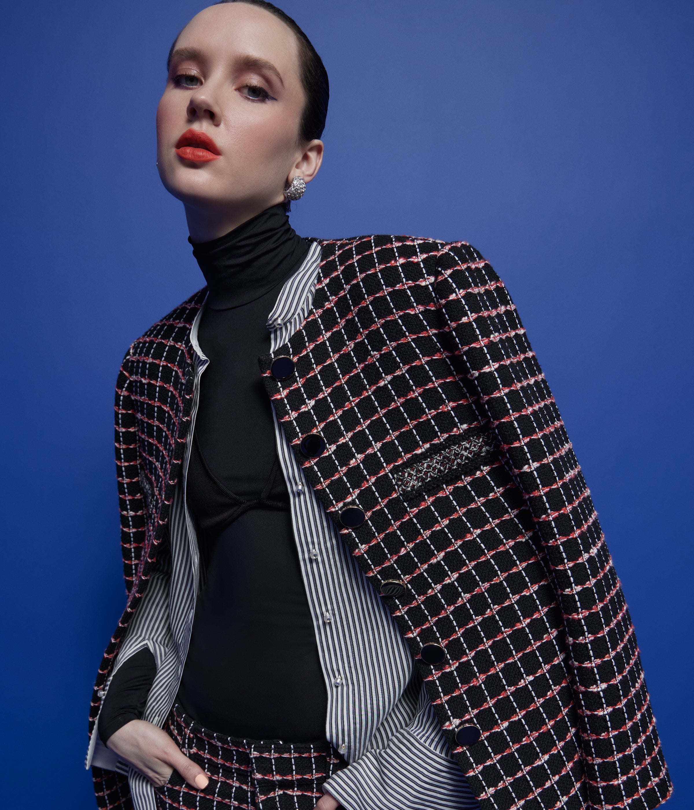 woman wearing St John Knots Resort 2025 plaid jacket and matching pants