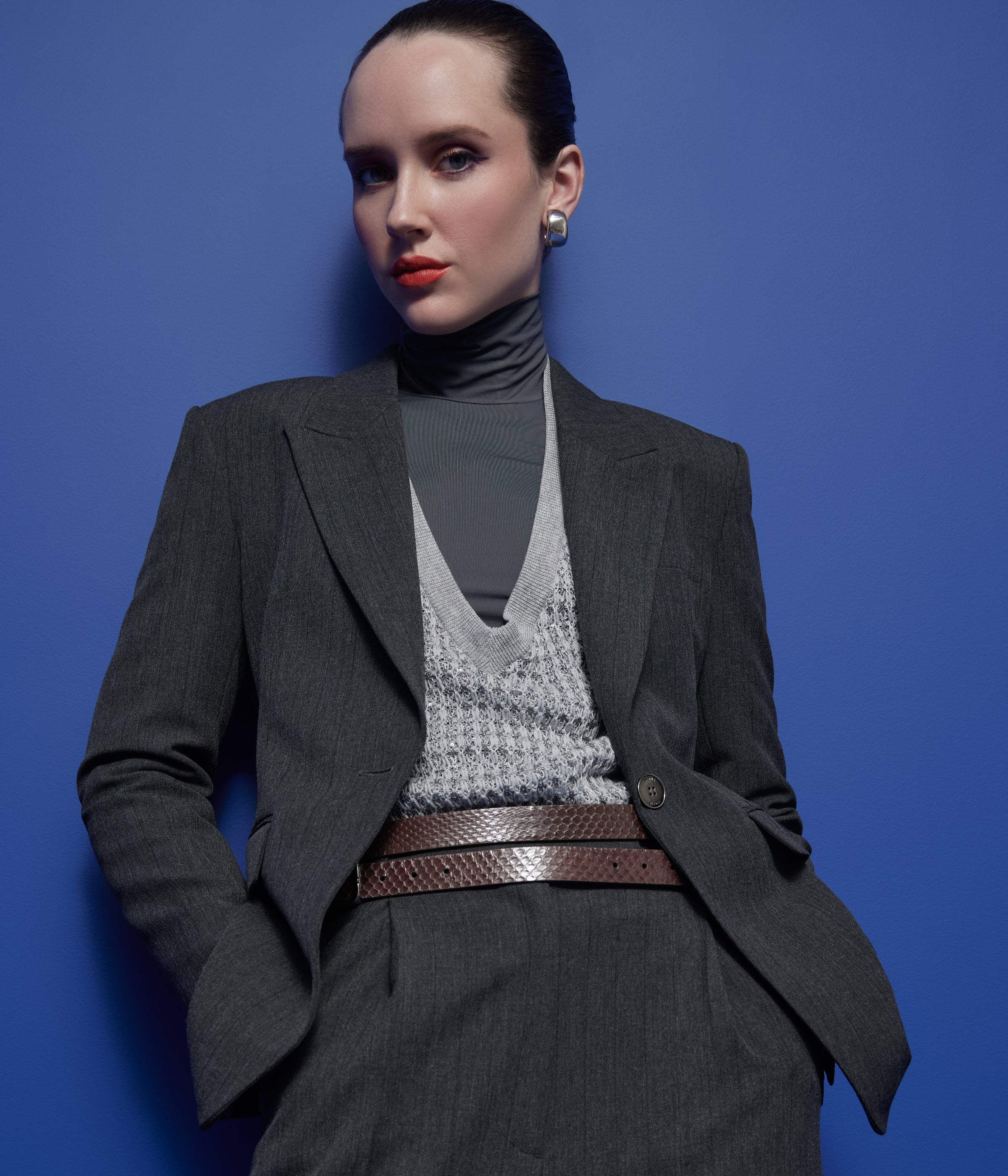 woman wearing St John Knits Resort 2025 grey sweater with matching jacket and skirt