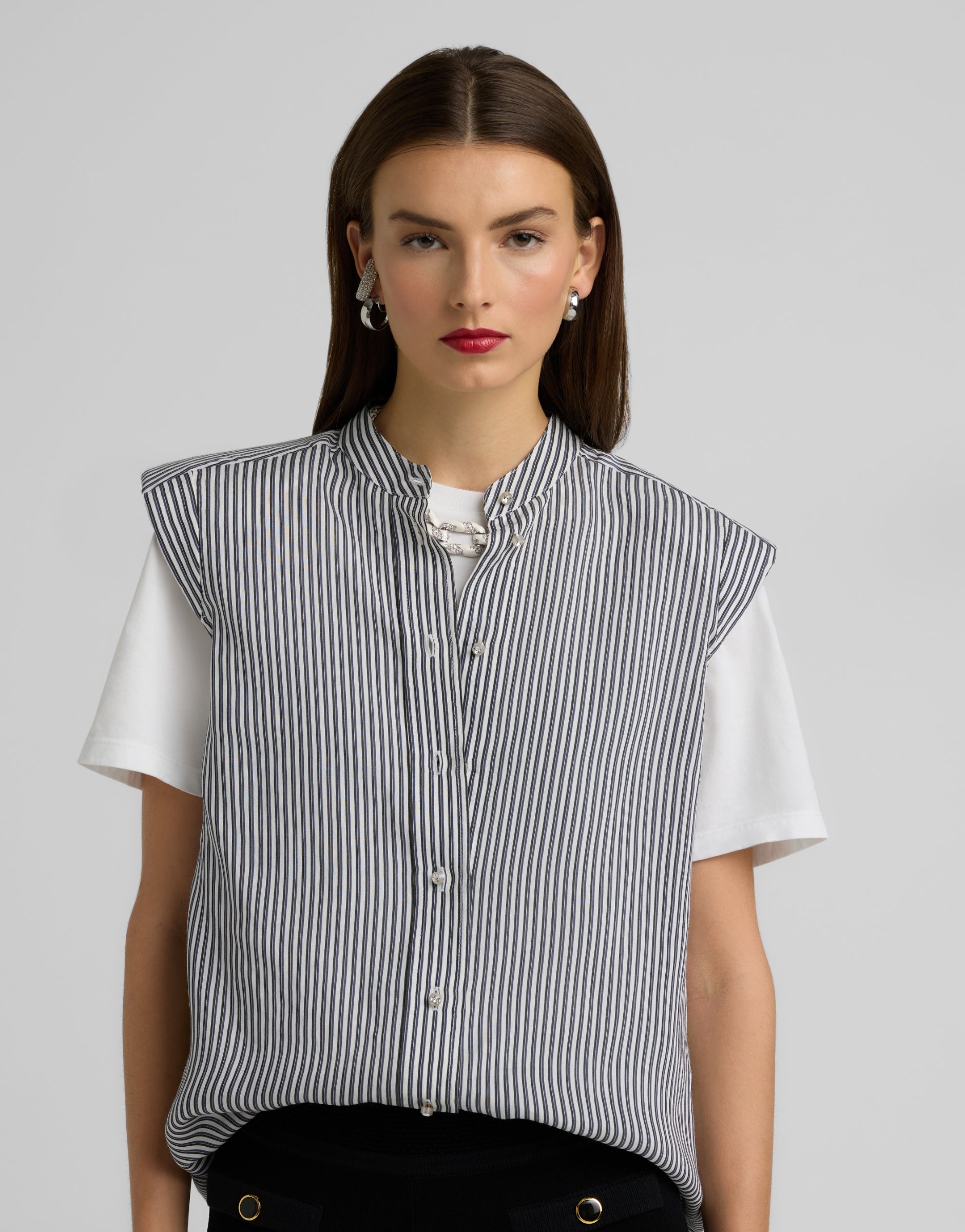 Woman wearing St John Knits Resort 2025 stripped cap sleeve top