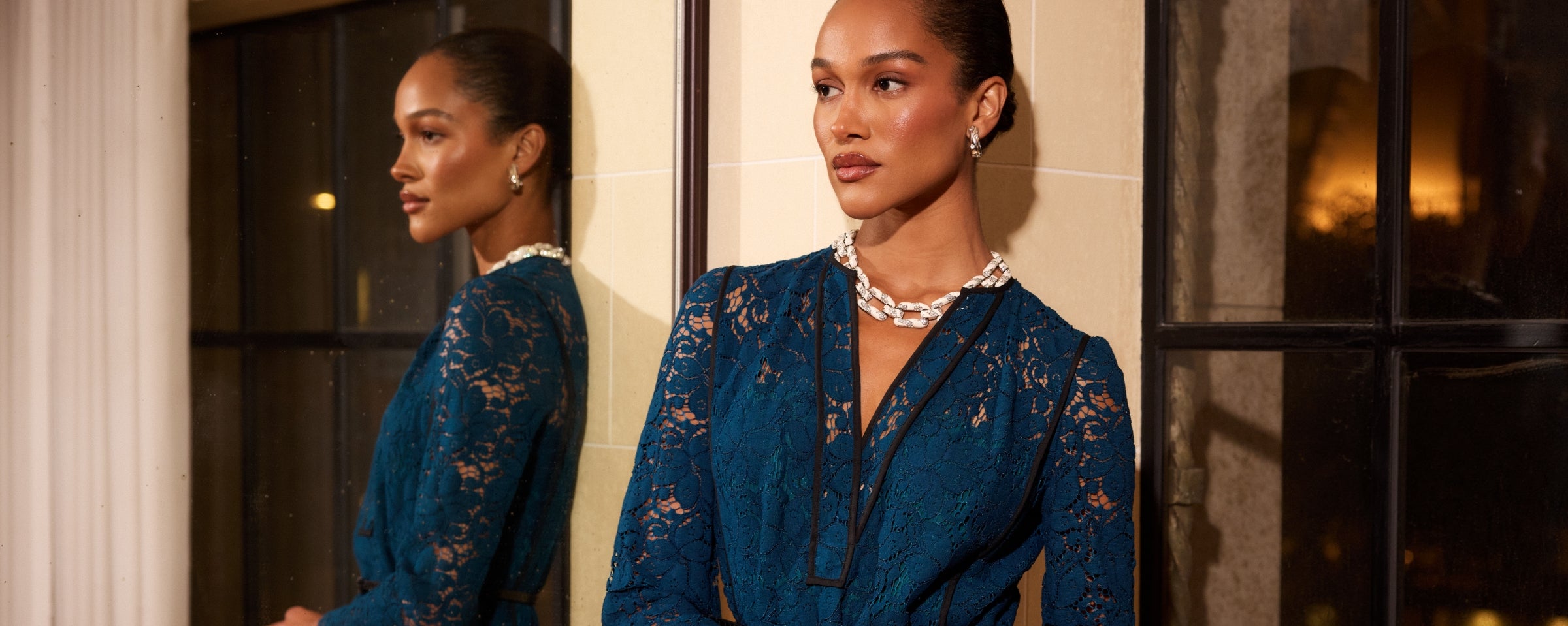 Woman wearing St John Knits Resort 2025 blue lace gown