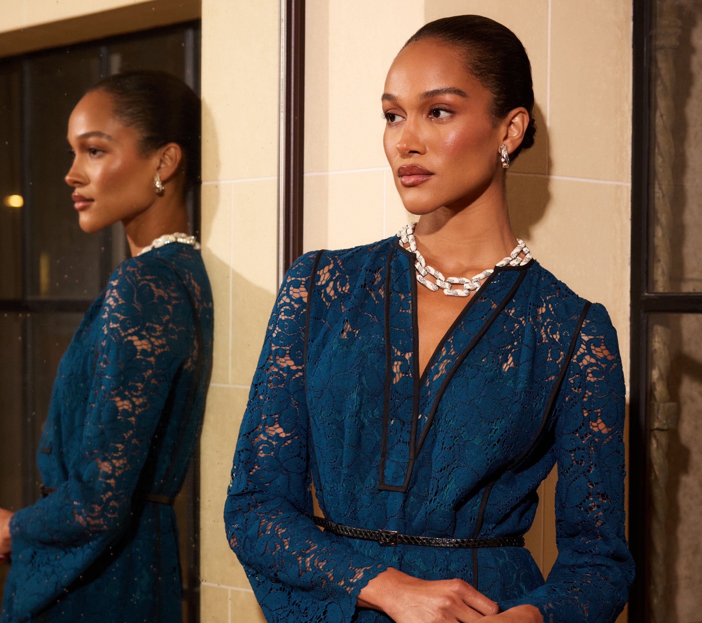 Woman wearing St John Knits Resort 2025 blue lace gown